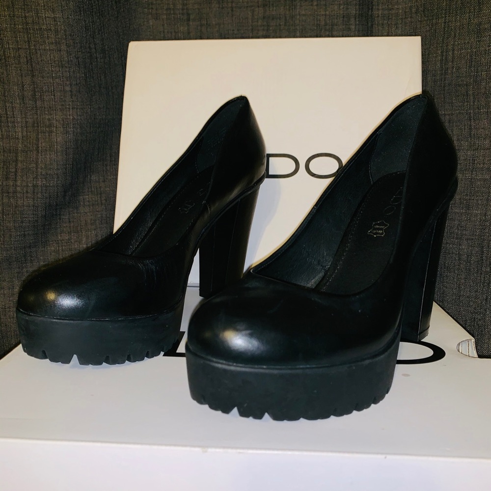 Black leather rubber bottom round toe heels